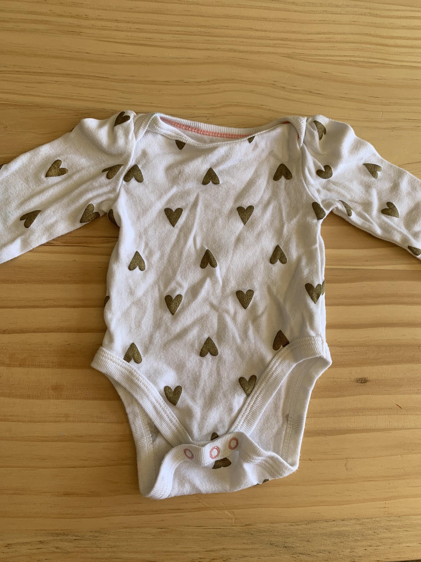 Girls Gold | White | Hearts Onesie Size: Newborn Gold | White | Hearts