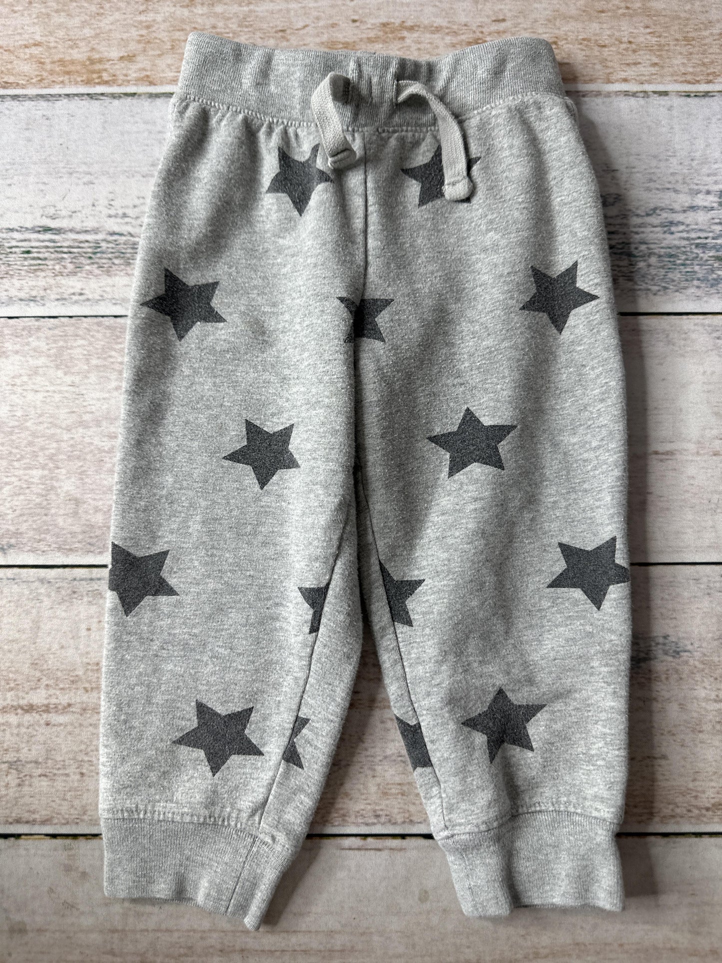 Primary Unisex Grey | Black | Stars Pants Size: 12-18 months Grey | Black | Stars