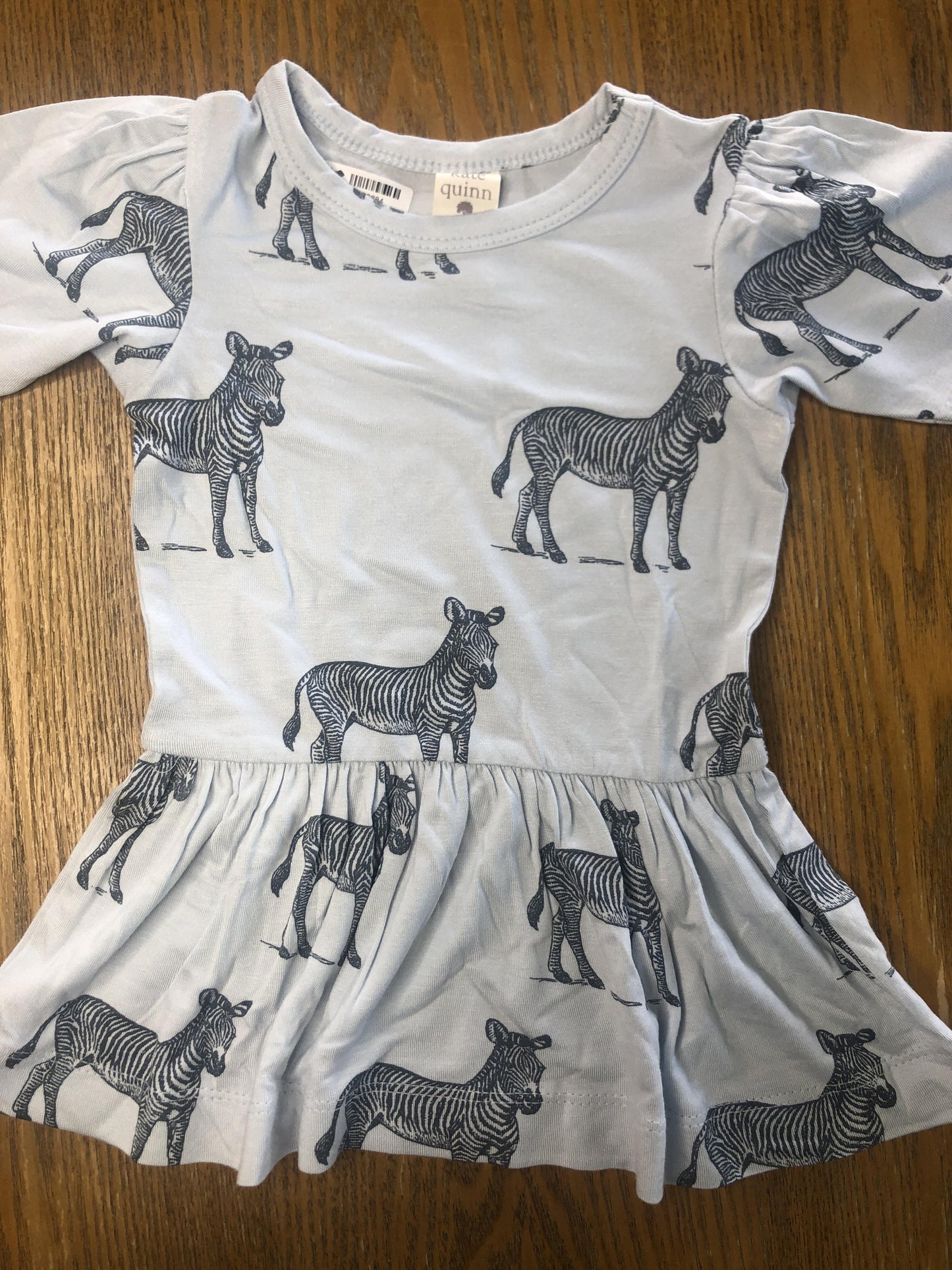 Kate Quinn Unisex Light Blue | Grey T-Shirt Size: 3-6 months Light Blue | Grey