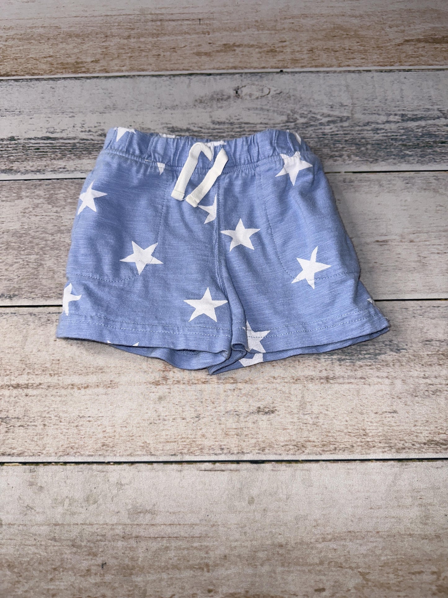 Primary Unisex Light Blue | Stars | White Shorts Size: 6-9 months Light Blue | Stars | White
