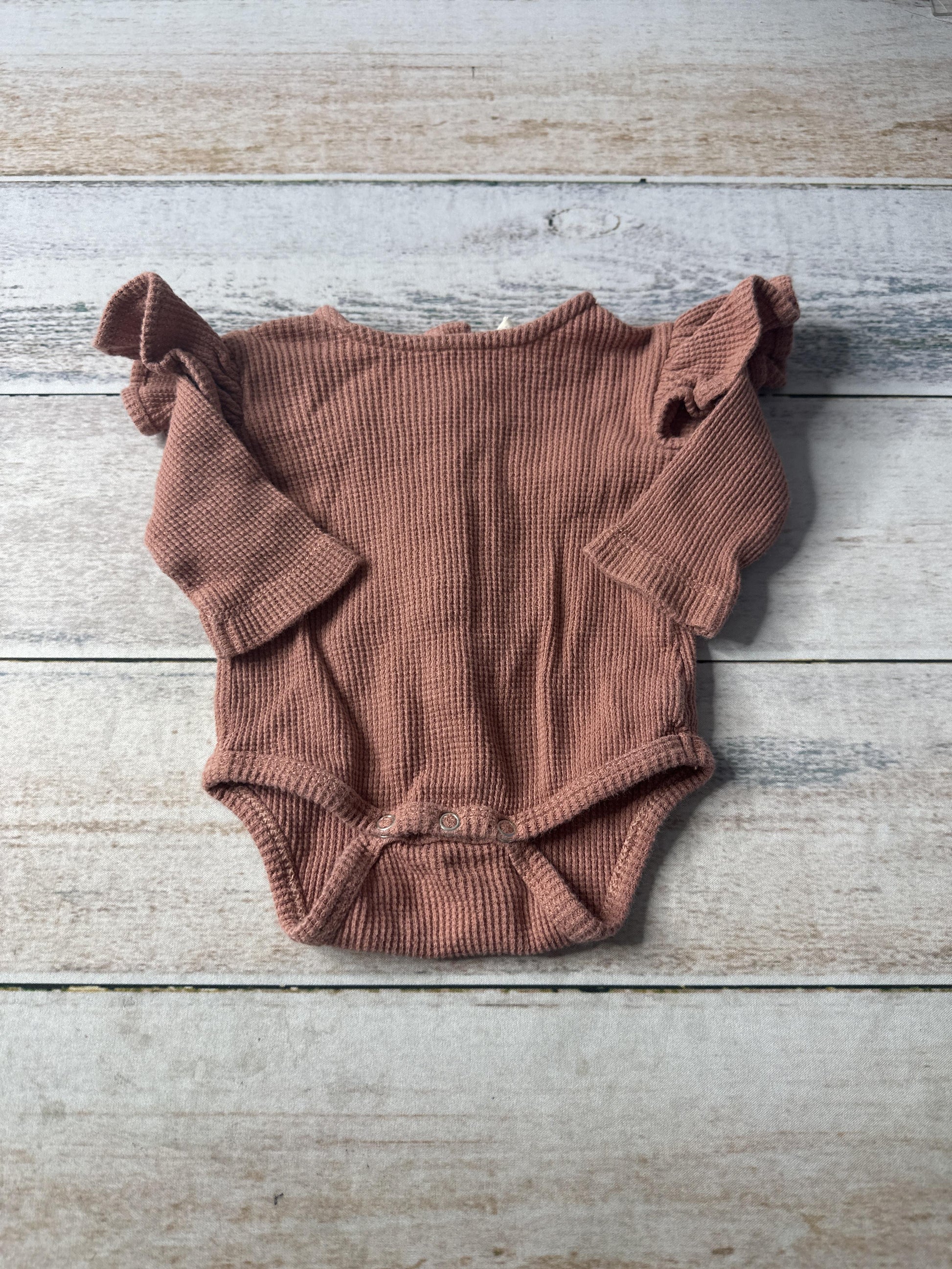 Kate Quinn Unisex Onesie Size: Newborn