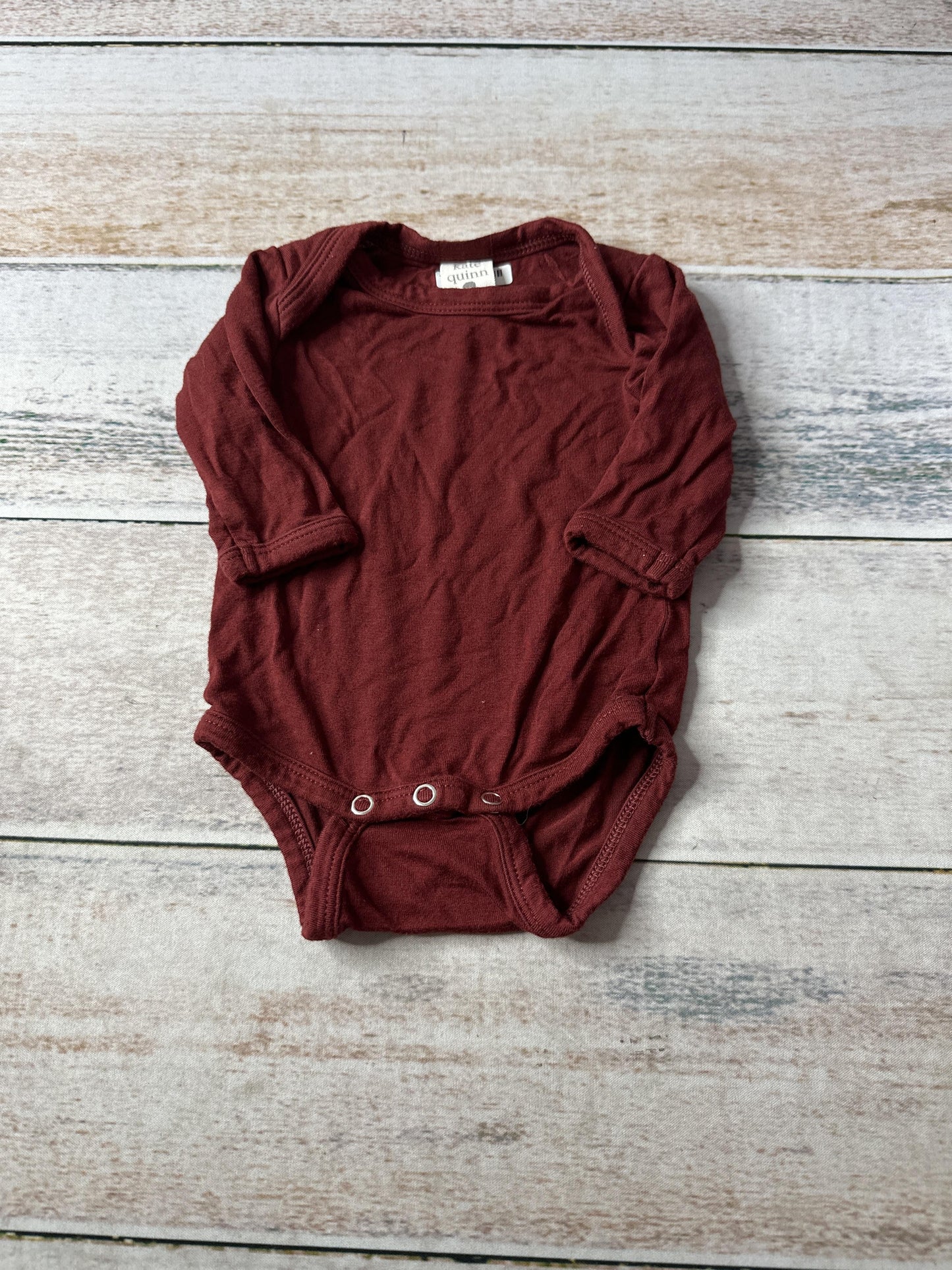 Kate Quinn Unisex Onesie Size: Newborn