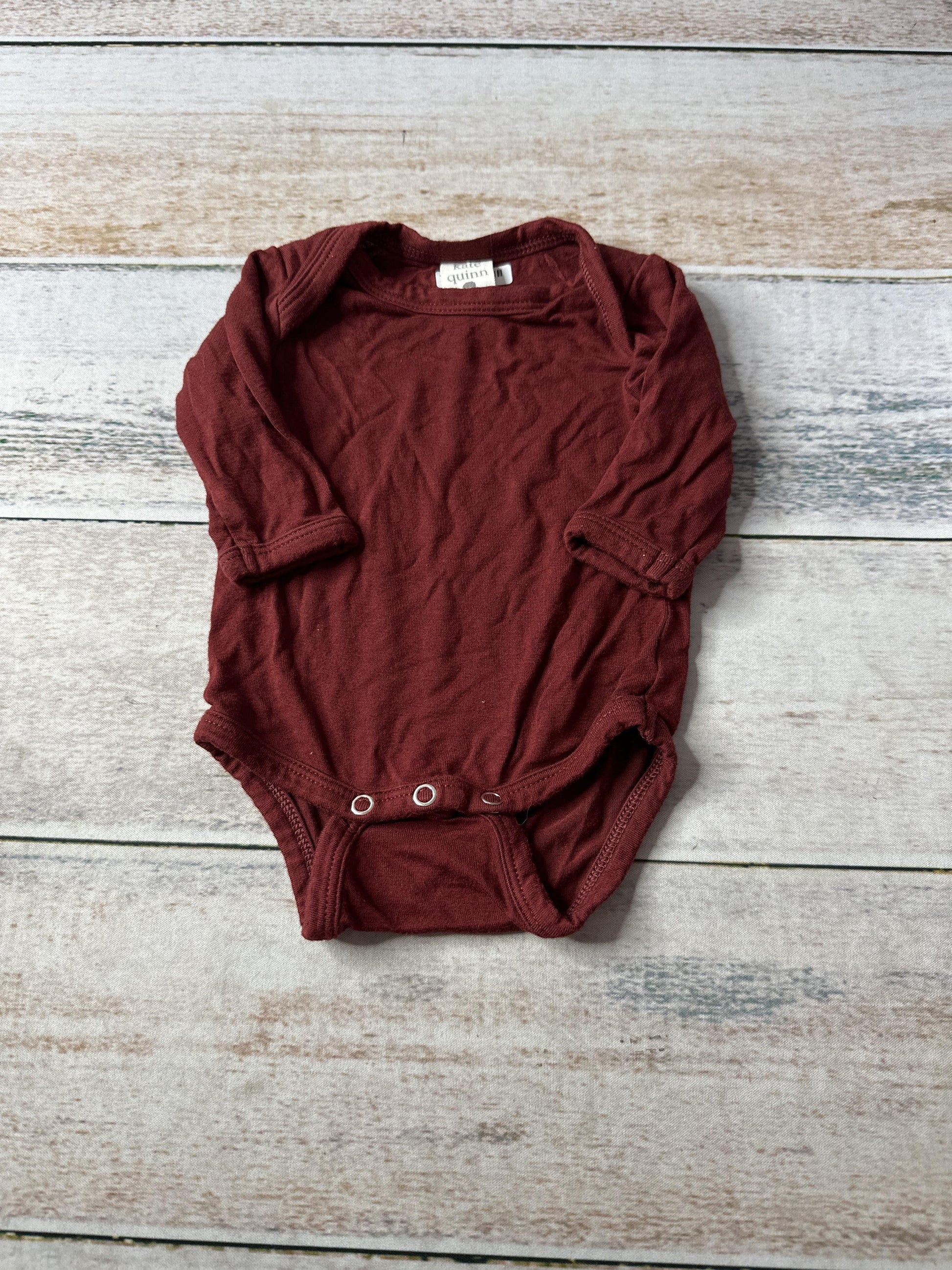 Kate Quinn Unisex Onesie Size: Newborn