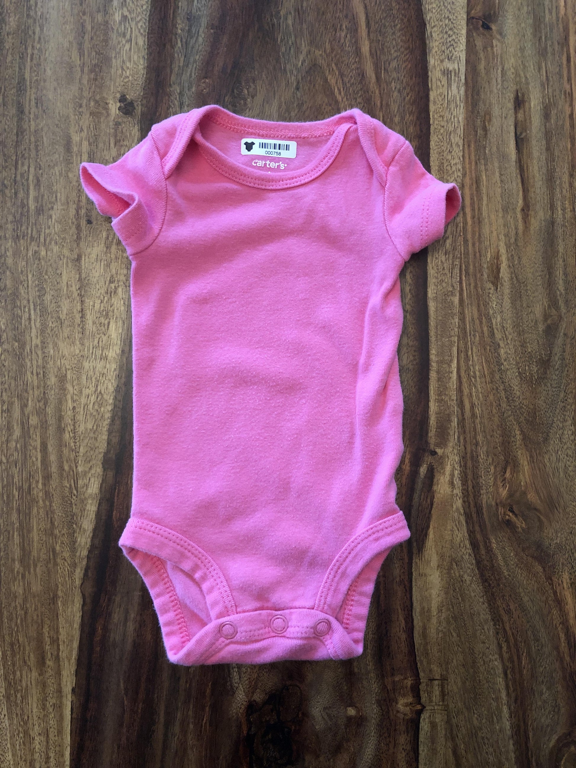 Carters Girls pink Onesie Size: Newborn pink