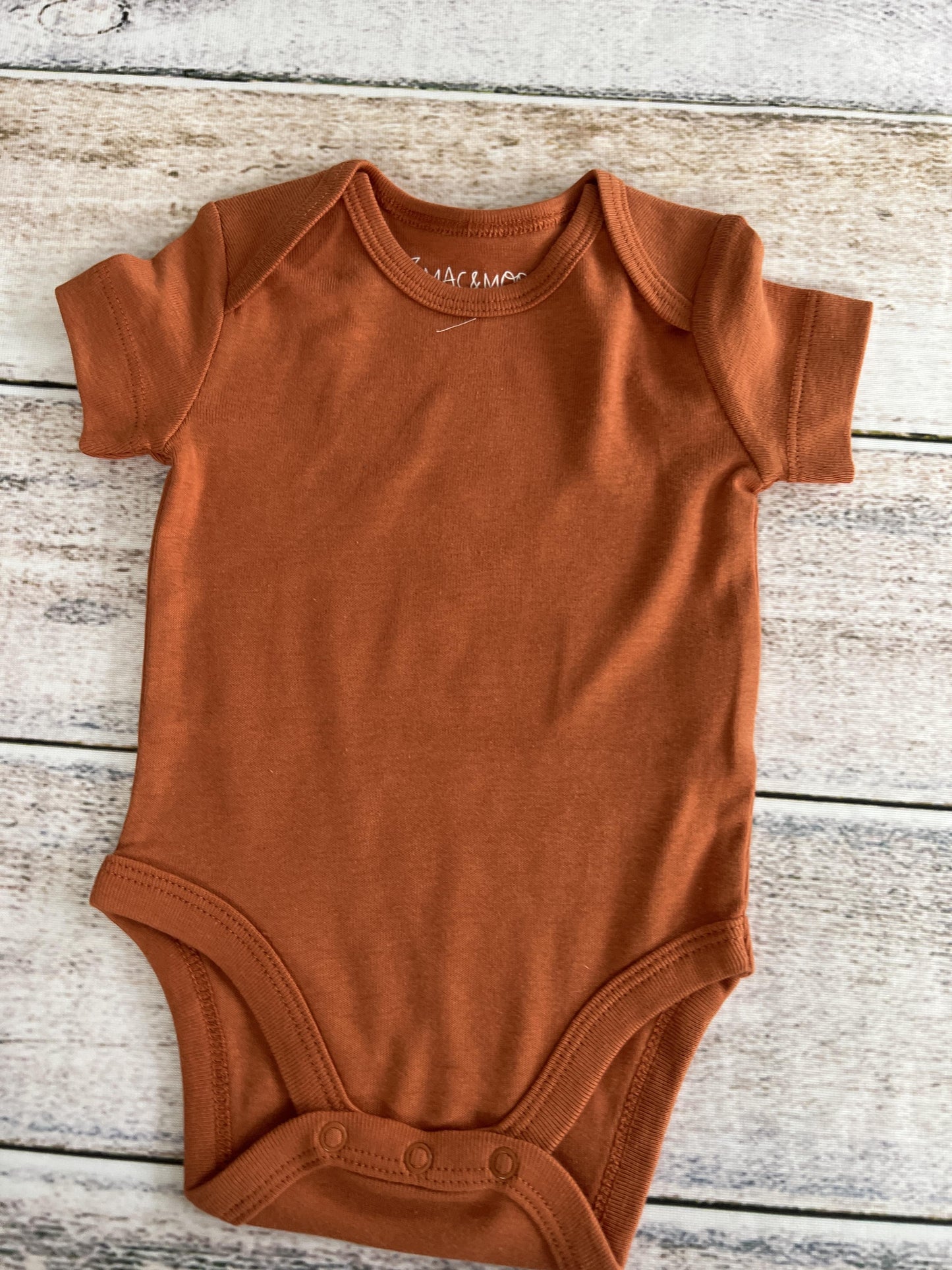 Unisex Rust Onesie Size: 3 months Rust