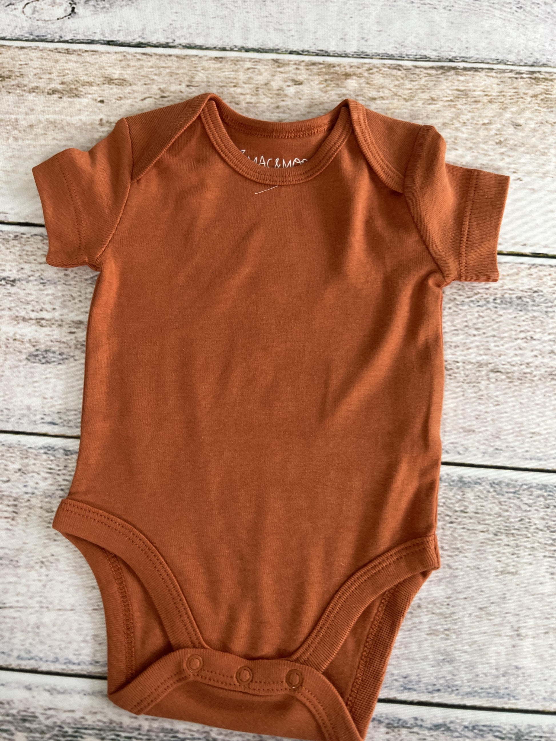 Unisex Rust Onesie Size: 3 months Rust
