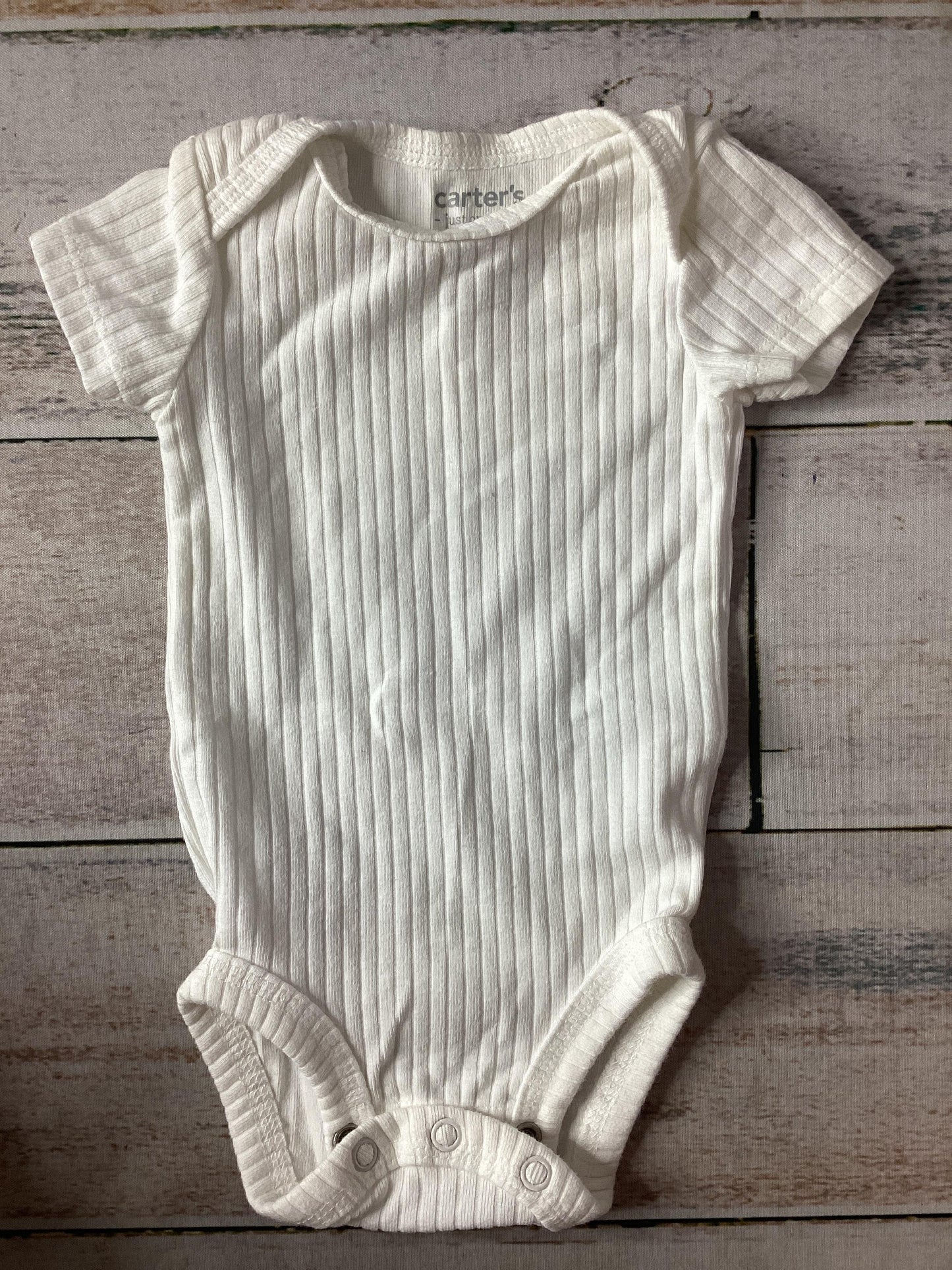 Unisex White Onesie Size: Newborn White