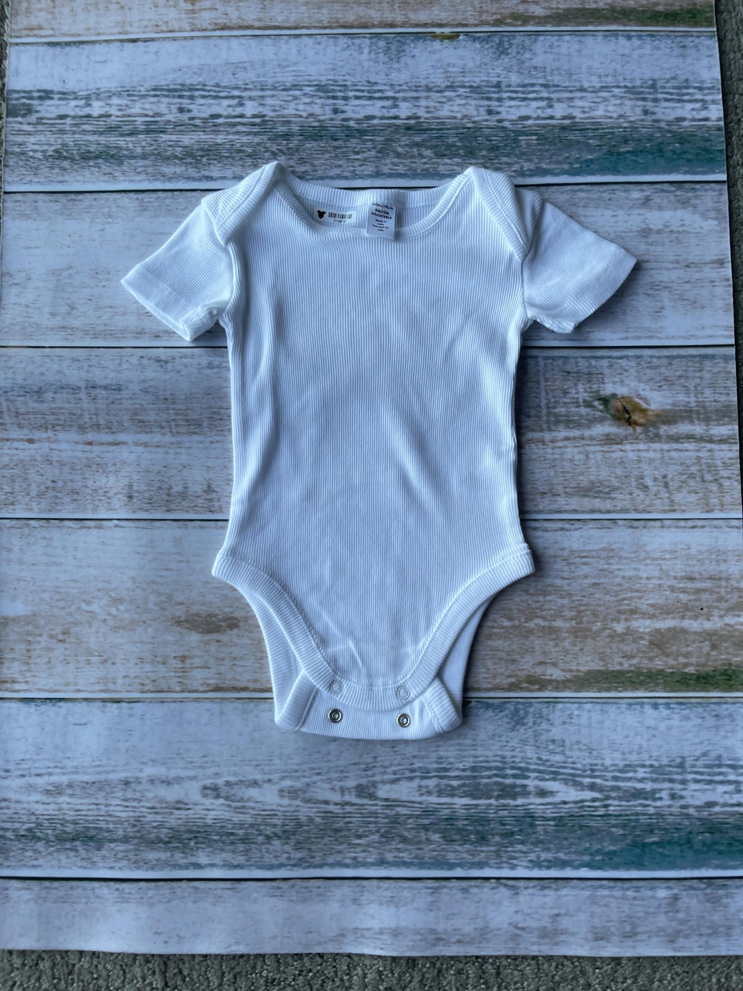 Unisex White Onesie Size: 9-12 Months White